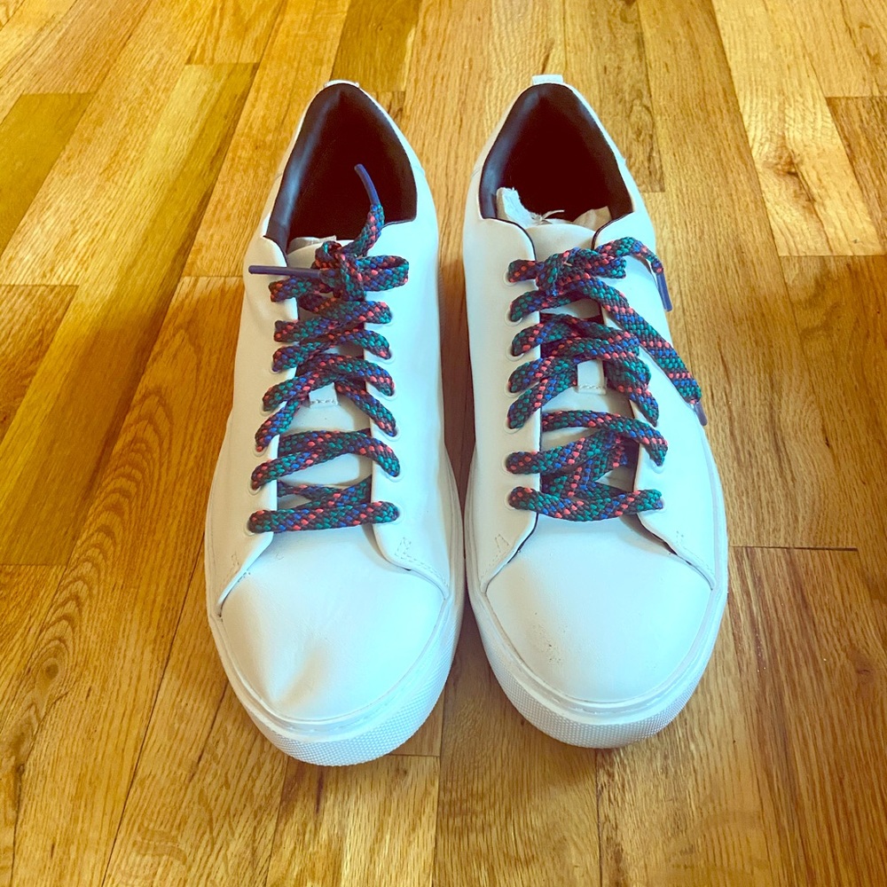 White leather Zara sneakers with black inside.